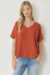 Solid v-neck top featuring asymmetric rounded hem detail. Unlined - 3 Colors