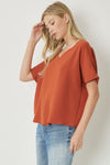 Solid v-neck top featuring asymmetric rounded hem detail. Unlined - 3 Colors