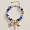 Vibrant Beaded Bracelet | Gold-Tone Trio Charms
