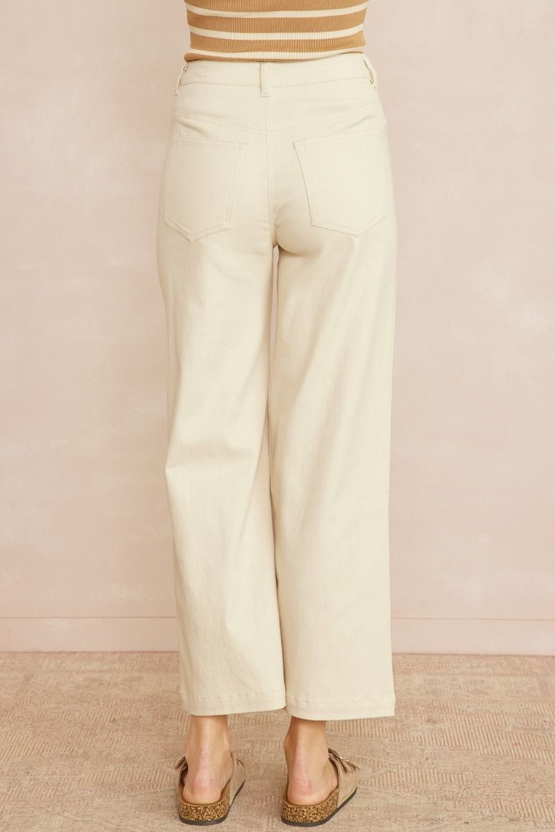 Acid wash high waisted wide leg pants featuring zipper front closure