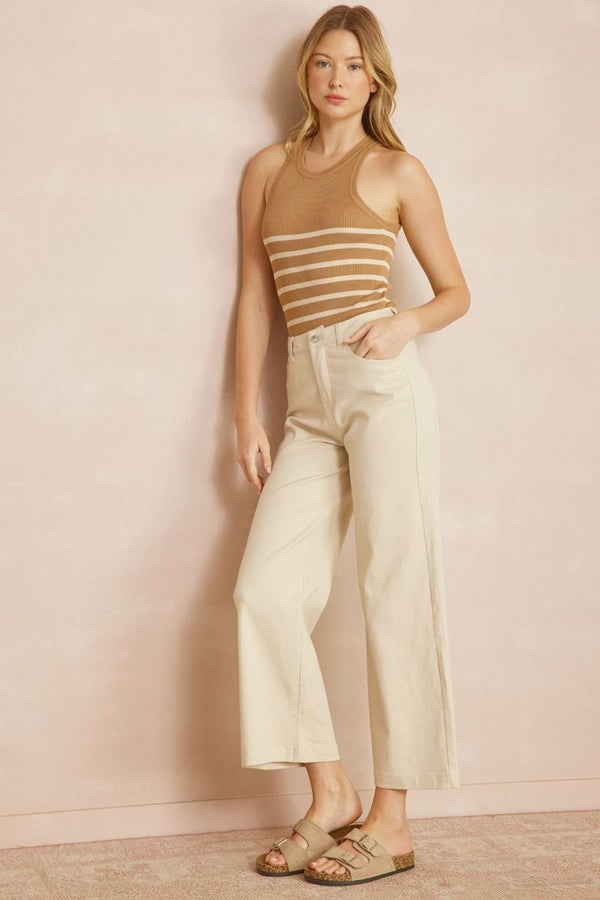 Acid wash high waisted wide leg pants featuring zipper front closure