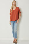 Solid v-neck top featuring asymmetric rounded hem detail. Unlined - 3 Colors
